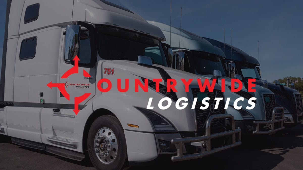 Opengraph image for the website of countrywide logistics, the logo over top of a fleet line of white trucks